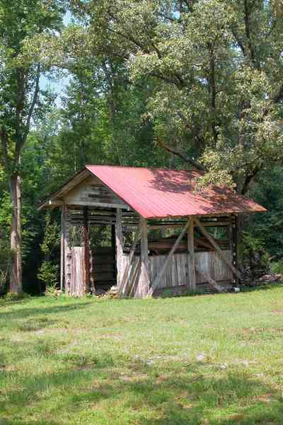 Century:-Tannenheim_23a.jpg:  victorian mansion, southern mansion, white columns, heart pine wood, tongue and groove walls, pasture, lake pecan orchard, plantation, rolling pastures, stable, timber, pump house, tin roof, log cabin country road