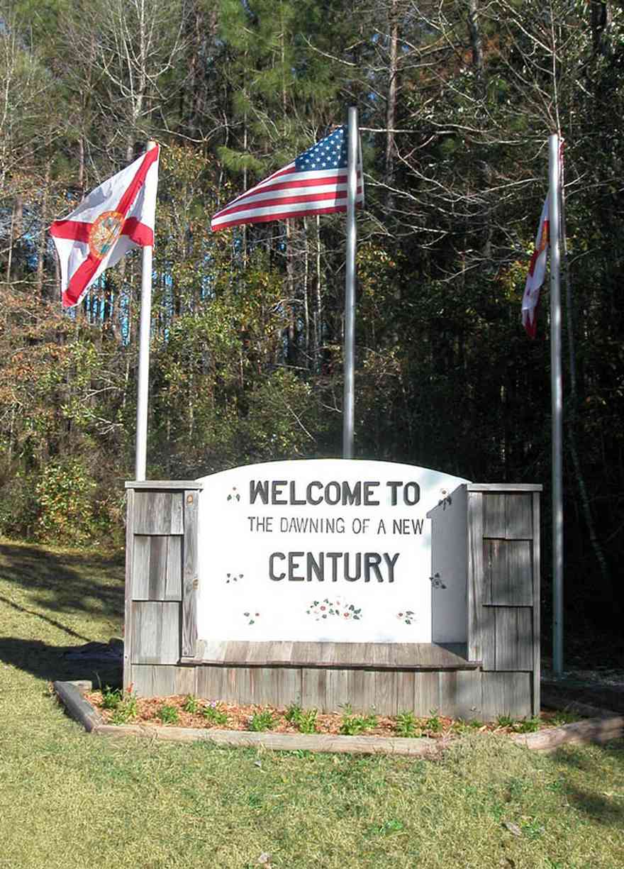 Century:-Town-Sign_01.jpg:  small town, flags, sign, town entrance
