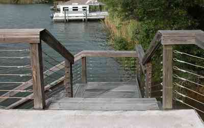 East-Hill:-1801-East-La-Rua-Street_16.jpg:  pensacola bay, shoreline, boat, plantoon boat, boat house, pier, dock, stairs, bayou texar