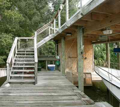 East-Hill:-1801-East-La-Rua-Street_18a.jpg:  boat, pier, deck, boardwalk, island, pensacola bay, bench, crab trap, railroad trestle