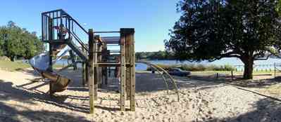 East-Hill:-Bayview-Park_11.jpg:  gulf coast, magnolia tree, oak tree, slide. bayou texar, sand, playground equipment