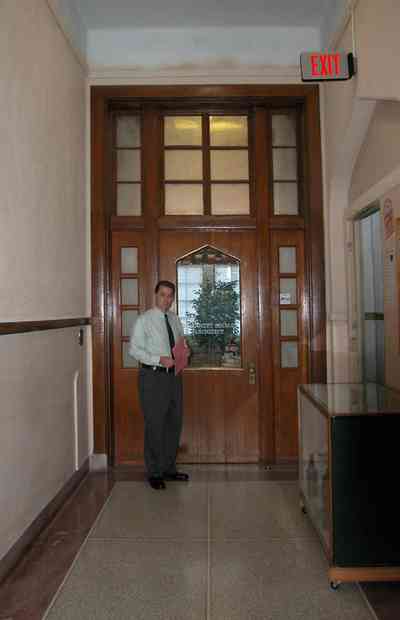 East-Hill:-Tower-East:-Old-Sacred-Heart-Hospital_37.jpg:  moorish arch, gothic revival architecture, granite floors, wooden doors, transom, hallway