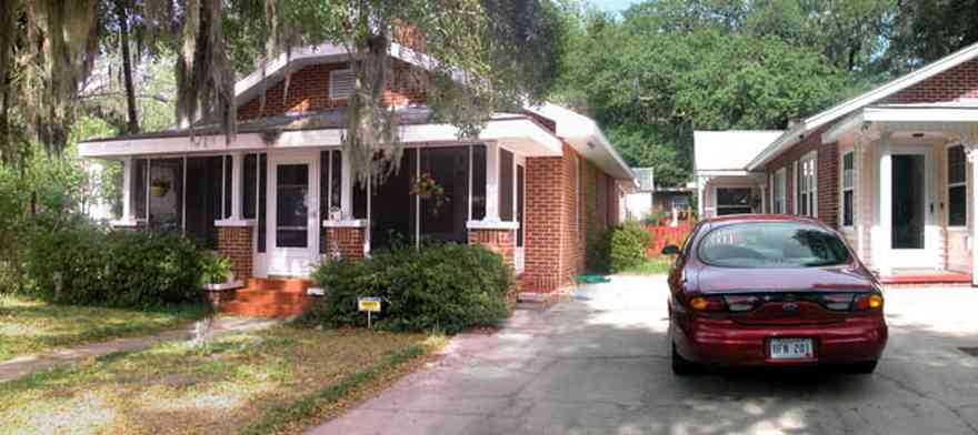 East-Pensacola-Heights:-118-Bayou-Blvd_01.jpg:  craftsman cottage, spanish moss, bayou texar, oak tree, red brick house