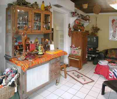 East-Pensacola-Heights:-600-Bayou-Blvd_20.jpg:  display cabinet, white ceramic tile floor, wooden ceiling, antique toys, antique dolls, family room