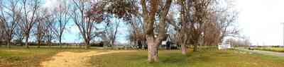 Elberta:-Heil-Farm_01.jpg:  pecan trees, dirt road, country road, deciduous trees, barn, highway sign, vegetable stand, farm, farmland