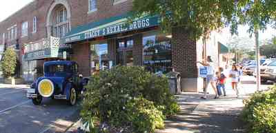 Foley:-Downtown_02.jpg:  storefront, model t-ford, drugstore, pharmacy, downtown, small town america, alabama, soda shop, flower garden