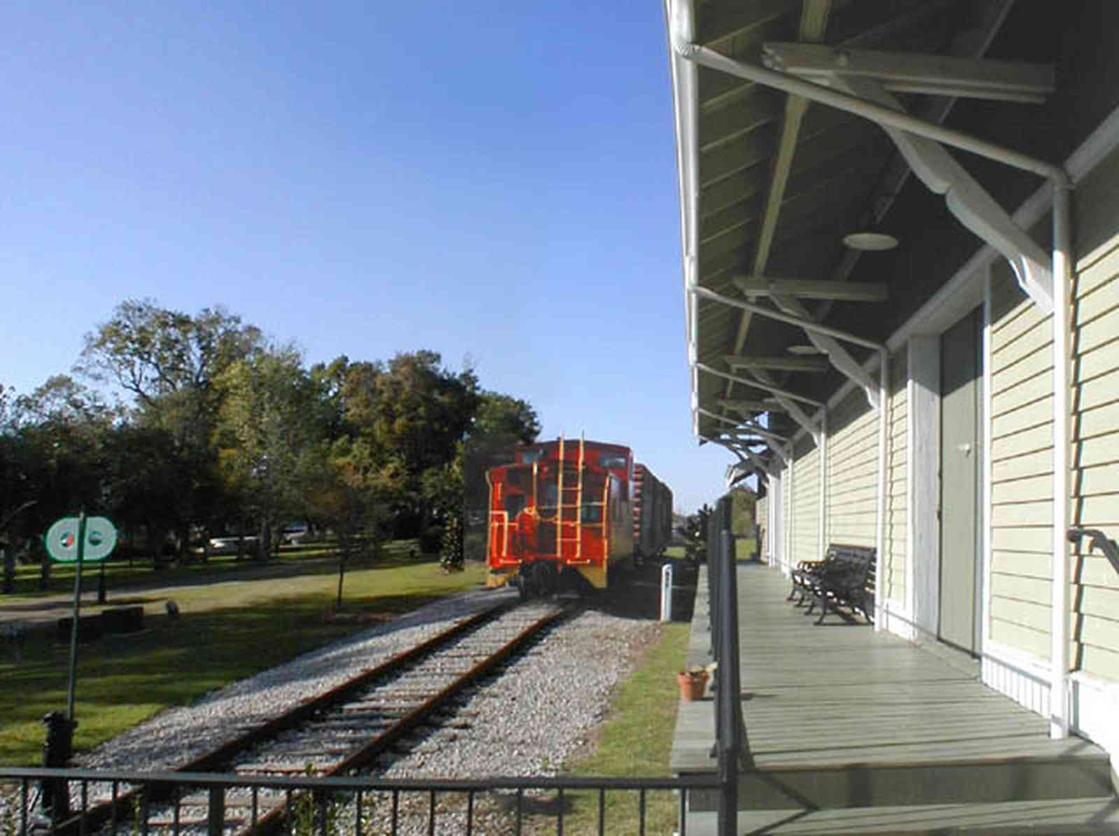 Foley:-Train-Station_03.jpg:  caboose, train station, depot, railroad, rail tracks, victorian architecture, oak trees