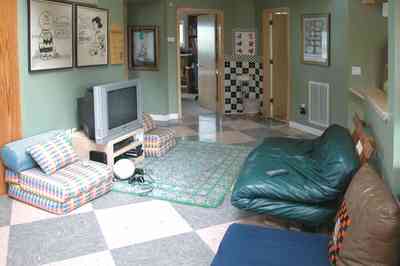 Gulf-Breeze:-92-High-Point-Drive_14a.jpg:  childrens bedroom, playstation, area rug, leather furniture, peanuts cartoons
