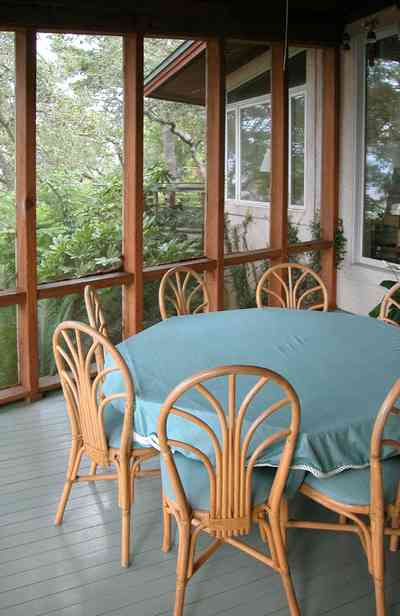 Gulf-Breeze:-92-High-Point-Drive_17a.jpg:  screened porch, bentwood furniture, deck, dining table, 