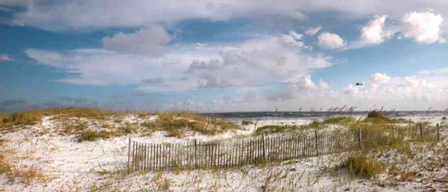 Gulf-Islands-National-Seashore:-Opal-Beach-Sign_01.jpg:  dune fence, dunes, gulf of mexico, sea oats, cirrus clouds, mixed skies, national seashore