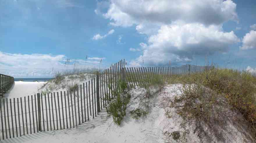 Gulf-Islands-National-Seashore:-Perdido-Key:-Johnson-Beach-Road-Turn-Around_01.jpg:  dune fence, sand dune, sea oats, gulf of mexico, cumulus clouds, boardwalk, barrier island
