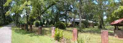 Jay:-Market-Road-Farm_00a.jpg:  farm house, water well, wishing well, brick columns, wrought iron fence, pecan orchard, cotton fields, country road