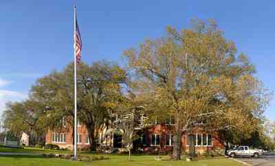 Milton:-Canal-Street-School_01.jpg:  school, administration, american flag, oak tree, red brick building