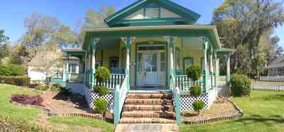 Milton:-Historic-District:-202-Berryhill-Street:-Chadwick-Hartsell-House_05.jpg:  white picket fence, steamboat house, victorian house, gingerbread, pediment, classical elements