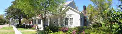 Milton:-Historic-District:-301-Pine-Street:-Butler-Potter-Schlenker-House_03.jpg:  picket fence, magnolia tree, victorian home, porch
