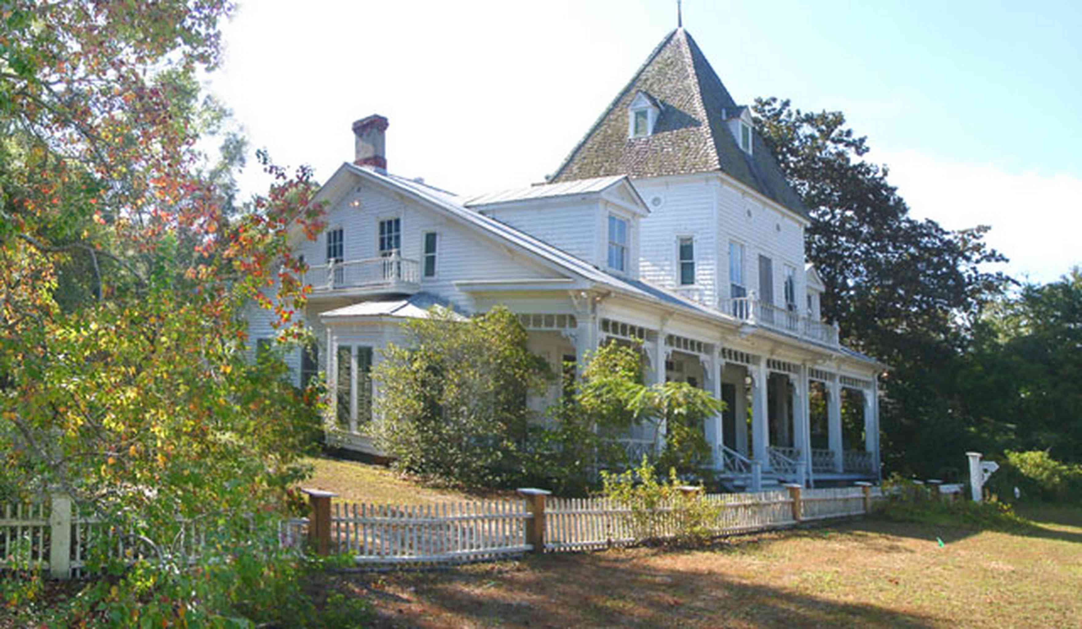 Milton:-Historic-District:-302-Pine-Street:-Ollinger-Tighman-House_--s-House_01.jpg:  victorian house, vivtorian front porch, picket fence, gothic style, gothic tower, victorian home