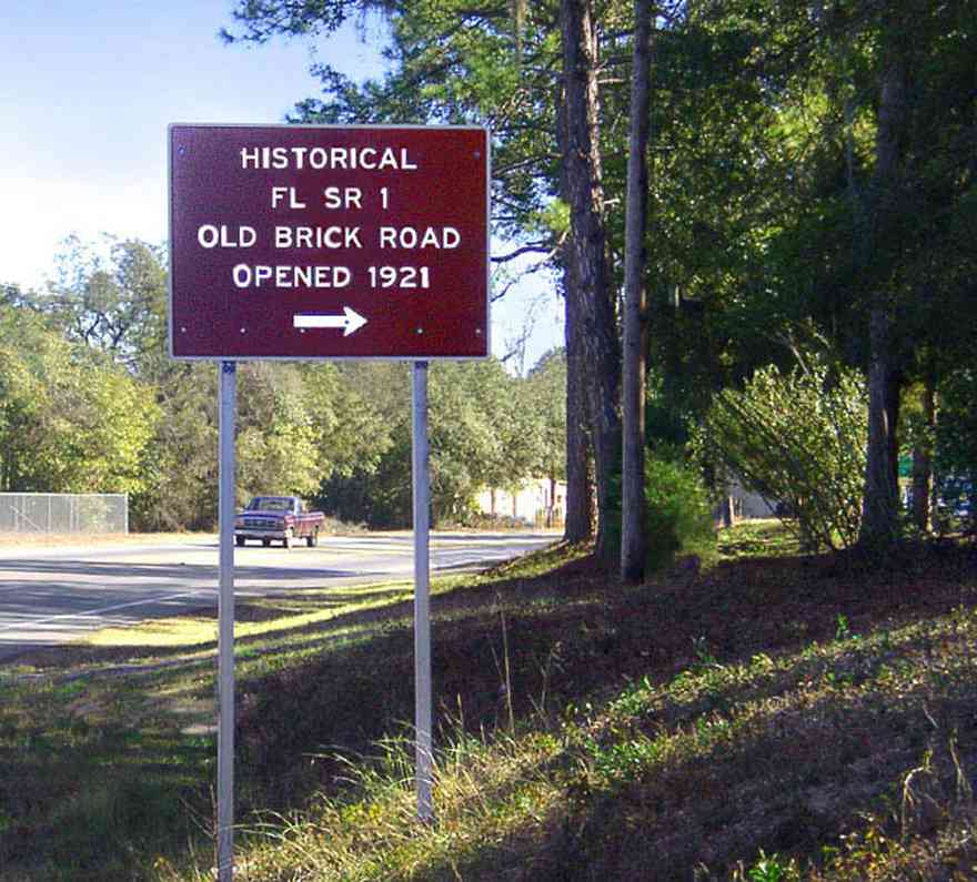 Milton:-Red-Brick-Road_00.jpg:  brick road, historic marker, highway, two-lane road, red brick