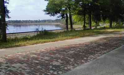 Milton:-Red-Brick-Road_15.jpg:  brick road, historic marker, highway, two-lane road, red brick