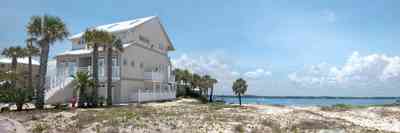 Navarre:-7332-Grand-Navarre-Blvd_02.jpg:  sand dune, palm trees, beach house, santa rosa sound, three-story house, luxury home, cumulus clouds