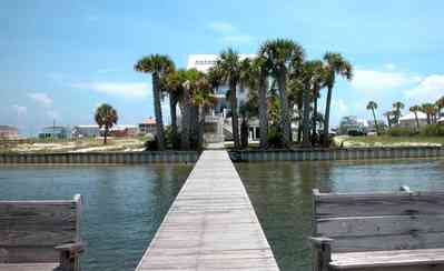 Navarre:-7332-Grand-Navarre-Blvd_07.jpg:  santa rosa sound, palm trees, dock, deck, sand dunes