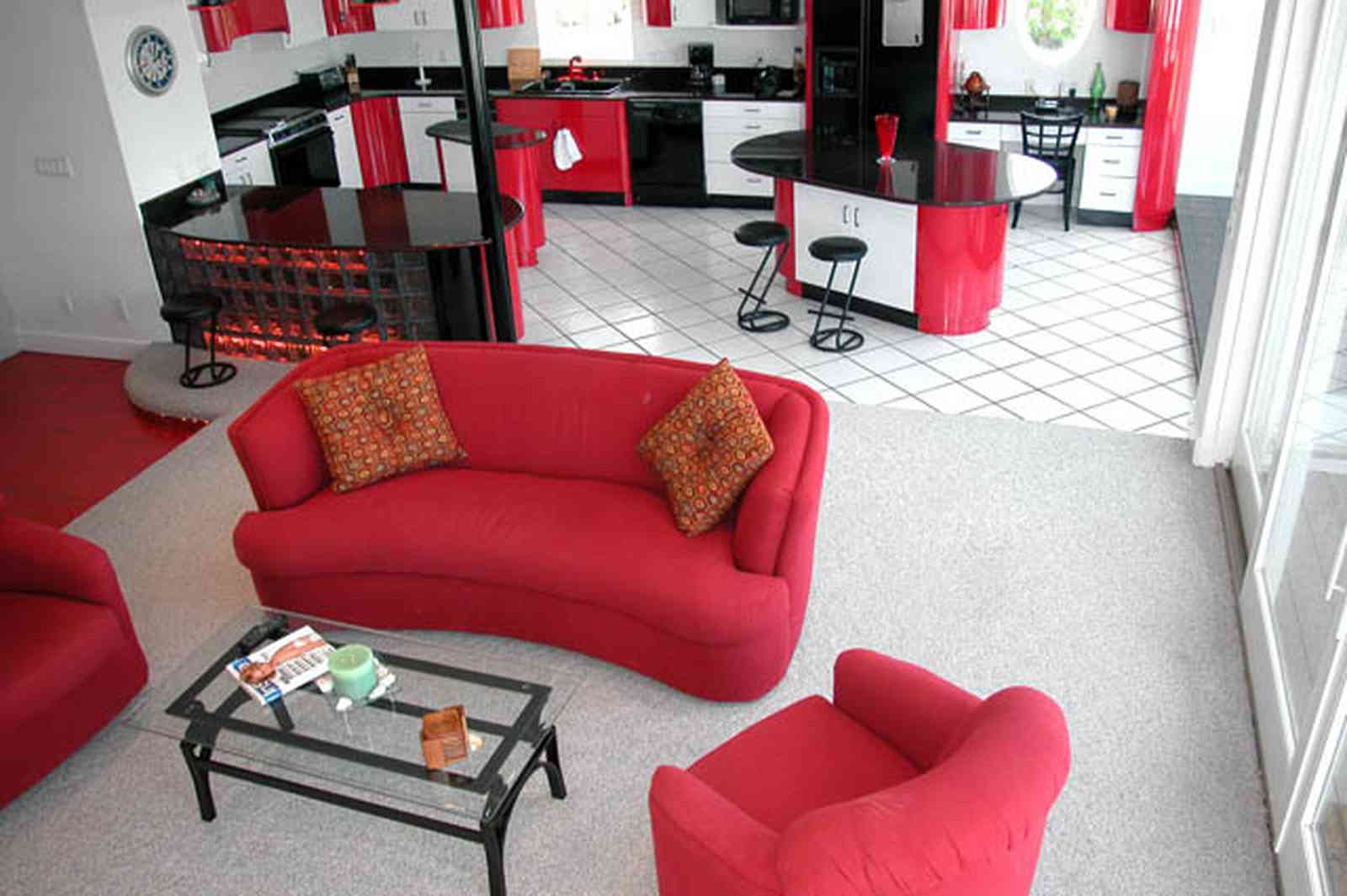 Navarre:-7332-Grand-Navarre-Blvd_20.jpg:  red lacquer cabinets, red and black, art deco decor, art deco house, kitchen, red kitchen cabinets, glass coffee table, glass brick bar, black laquer cabinets