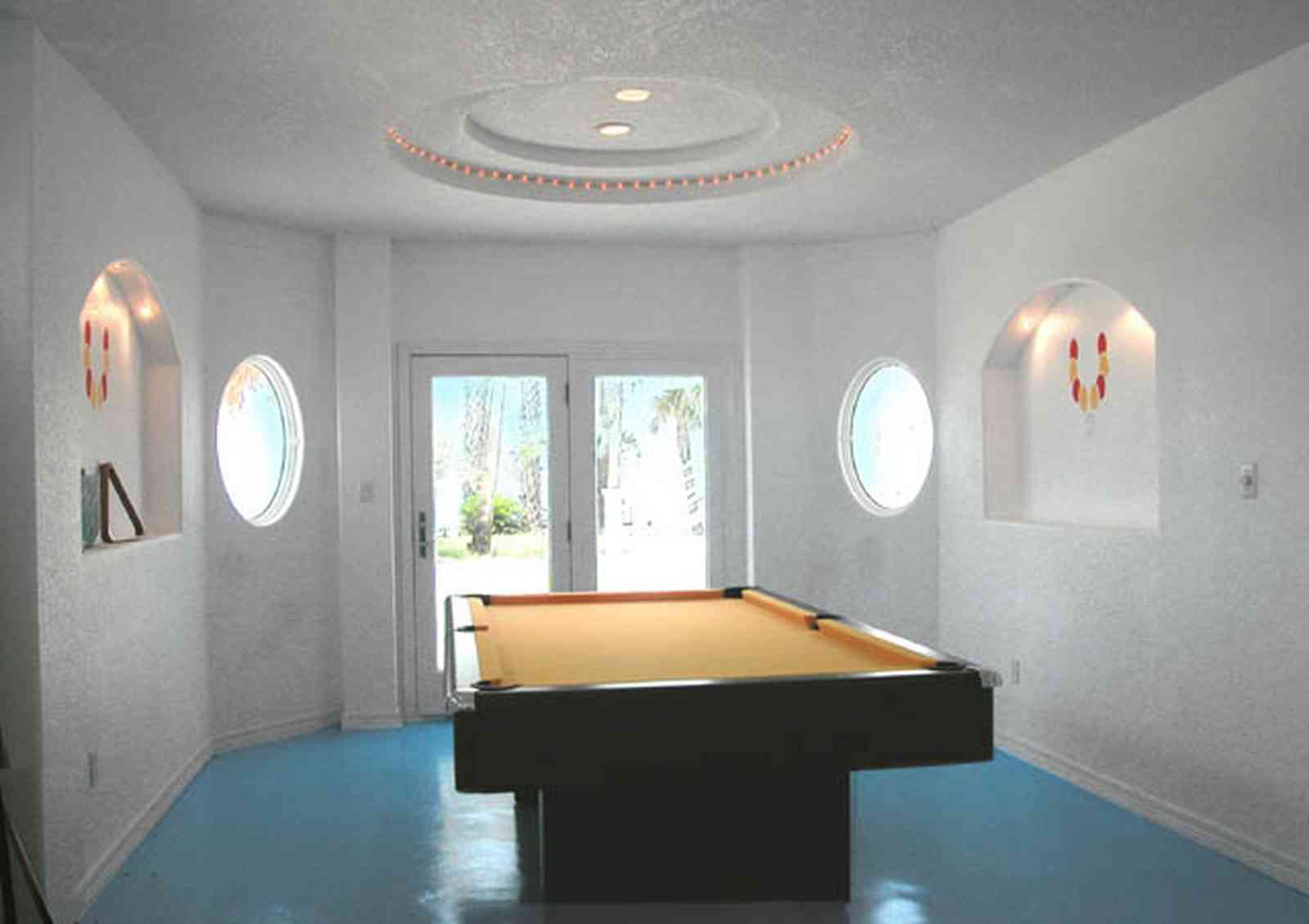 Navarre:-7332-Grand-Navarre-Blvd_65.jpg:  game room, pool room, art deco decor, painted floor, beach house, santa rosa sound
