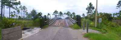 Navarre:-Biscayne-Pointe-Drive-House_01.jpg:  gate, bridge, wooden bridge, pine tree, marsh, wet land, swamp, gated entrance