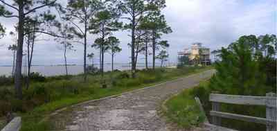 Navarre:-Biscayne-Pointe-Drive-House_05.jpg:  wetland, driveway, wooden bridge, house, escambia bay