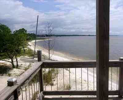 Navarre:-Biscayne-Pointe-Drive-House_13.jpg:  santa rosa sound, sail boat, deck, porch, sand water, pine tree, shoreline