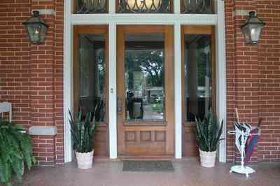 North-Hill:-116-DeSoto-St_02a.jpg:  red brick house, gas lanterns, fern, mother-in-law tongue, umbrella stand, etched glass door