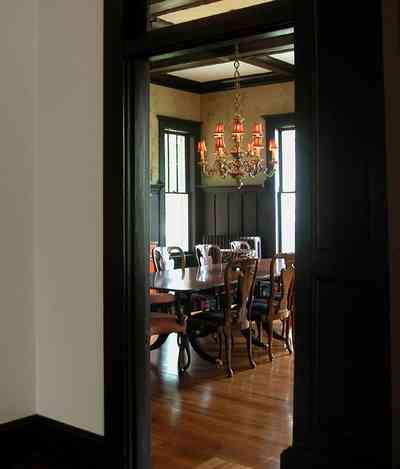 North-Hill:-116-DeSoto-St_02o.jpg:  heartpine floors, coffered ceilings, wainscotting, dining room table, chandelier