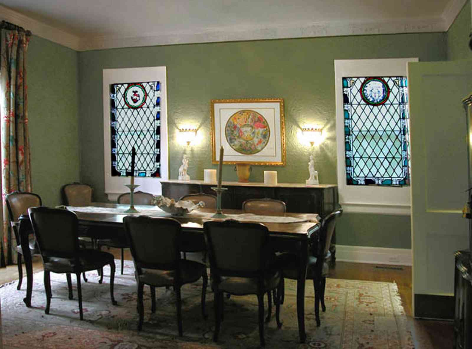 North-Hill:-123-West-Lloyd-Street_15.jpg:  dining room, stained glass windows, oriental rug, swinging door, drapes, front room, italienate architecture