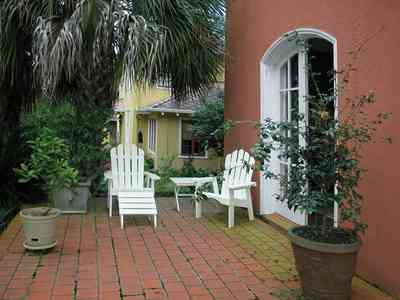 North-Hill:-123-West-Lloyd-Street_19.jpg:  palm trees, trees, spanish colonial revival style, terrazzo tiles, urn, flower pots stucco finishing