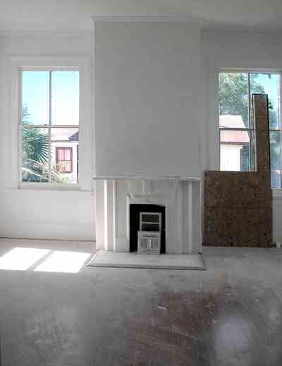 North-Hill:-200-West-Jackson-Street_33.jpg:  heart pine floor, mantle, fireplace, victorian home, casement windows, palm trees