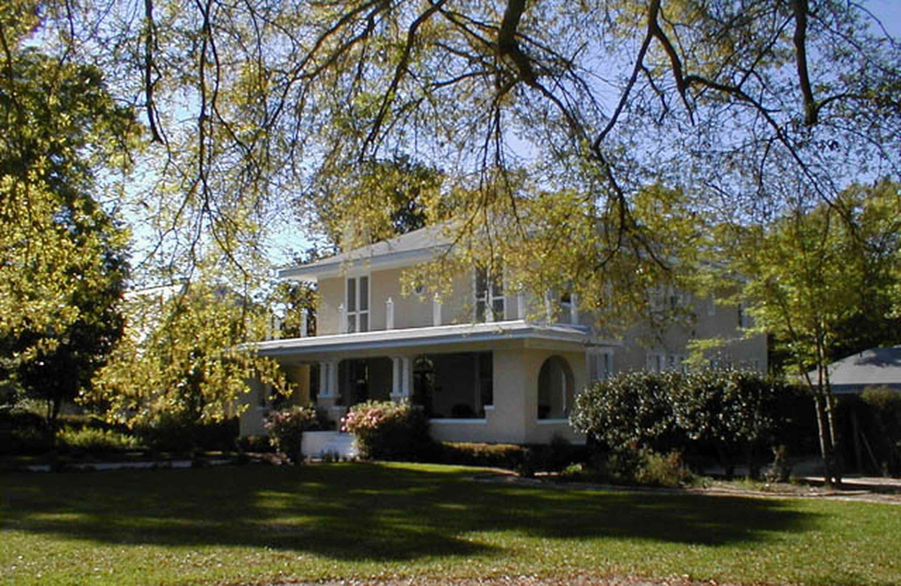 North-Hill:-206-West-Lloyd-Street_02.jpg:  oak tree, prairie style architecture, front porch, rose bush, azalea bushes, gazebo