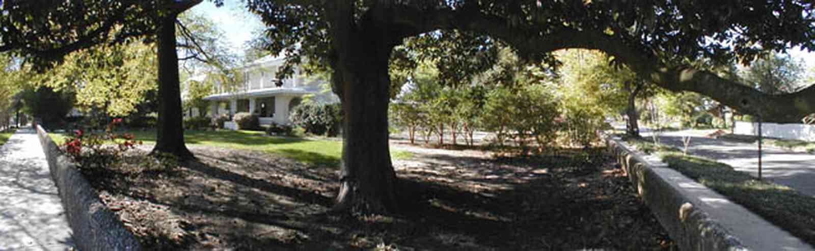 North-Hill:-206-West-Lloyd-Street_03.jpg:  oak tree, prairie style architecture, front porch, rose bush, azalea bushes, gazebo