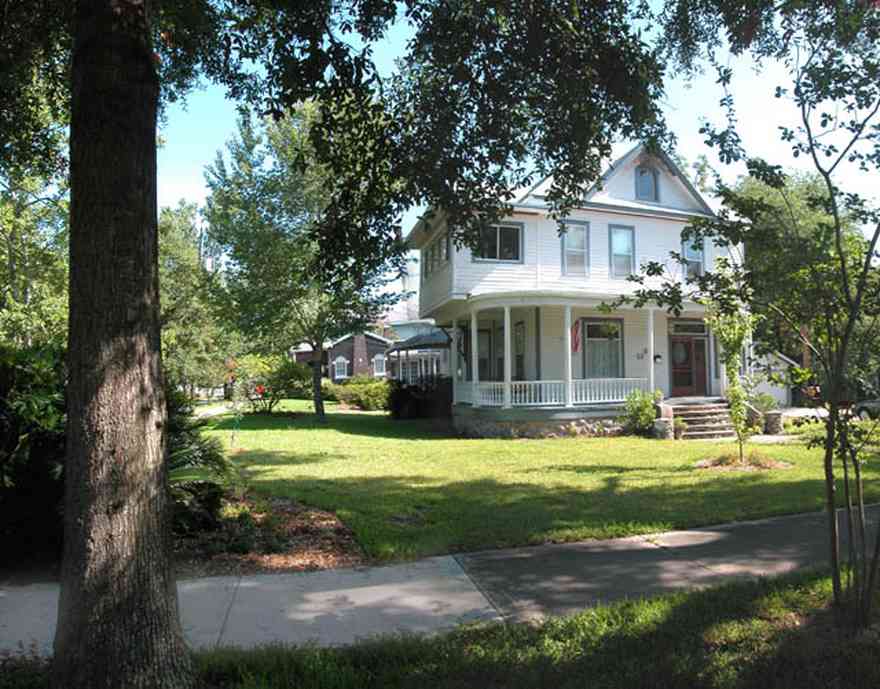 North-Hill:-52-West-Gonzalez-Street_01.jpg:  victorian home, front porch, pediment, stone staircase, casement windows, garage, queen anne architectural style