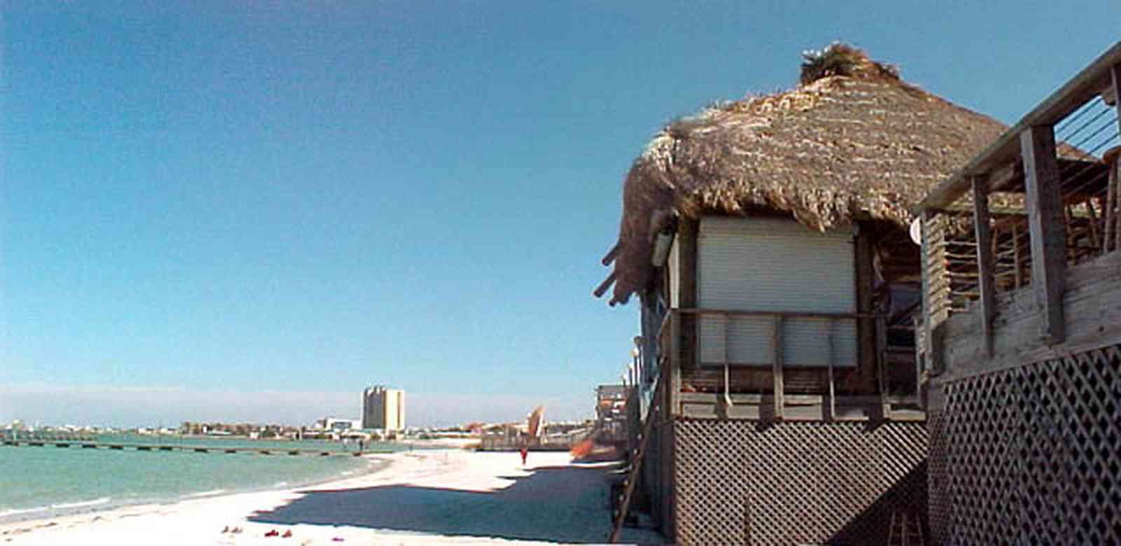 Pensacola-Beach:-Bamboo-Willies_03.jpg:  bamboo hut, tiki torch, bar, restaurant, gulf of mexico, sound, gulf coast, sand