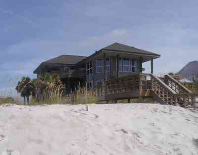 Pensacola-Beach:-Hermosa-St-Homes_09.jpg:  sea oats, sand dunes, palm trees, boardwalk, gulf of mexico