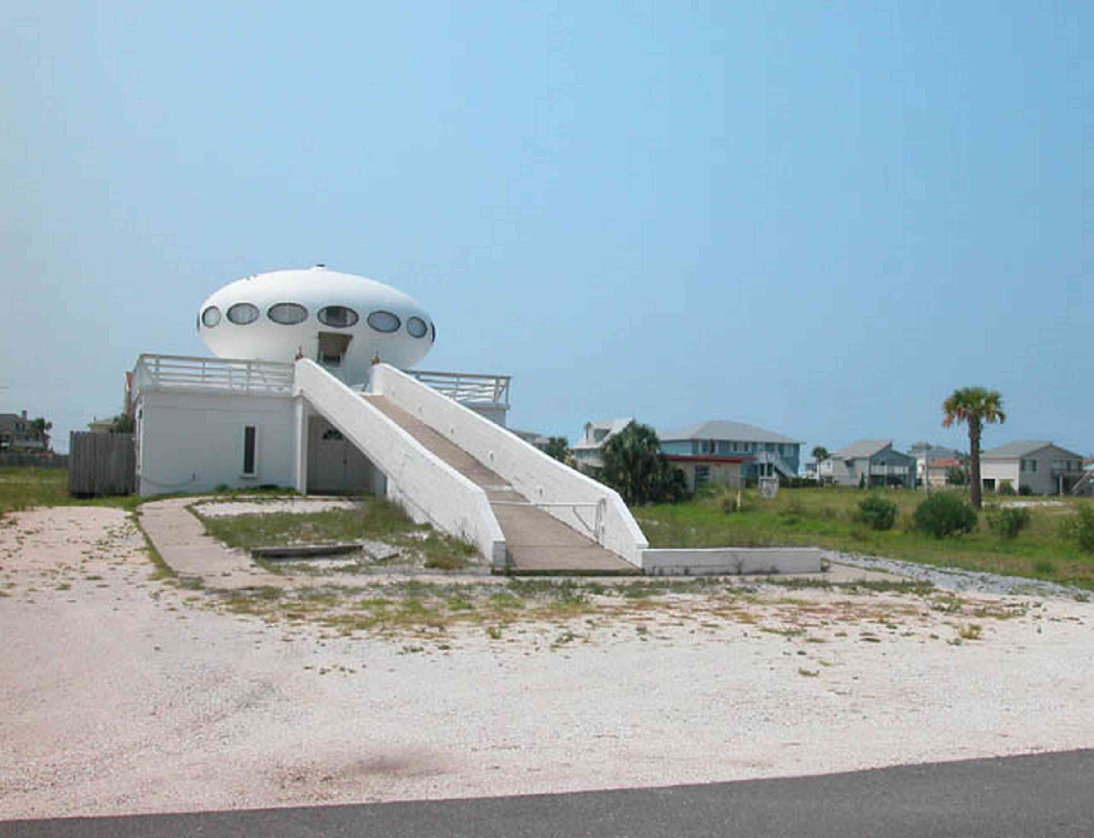 Pensacola-Beach:-Panferio-Road-Flying-Saucer-House_01.jpg:  flying saucer house, beachfront property, palm tree, cement block construction, 1950\