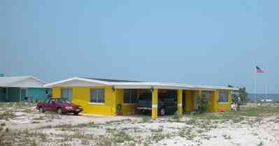 Pensacola-Beach:-Rio-Vista-Drive_06.jpg:  cement block house, yellow house, 1950's architecture, beach front house, pensacola bay