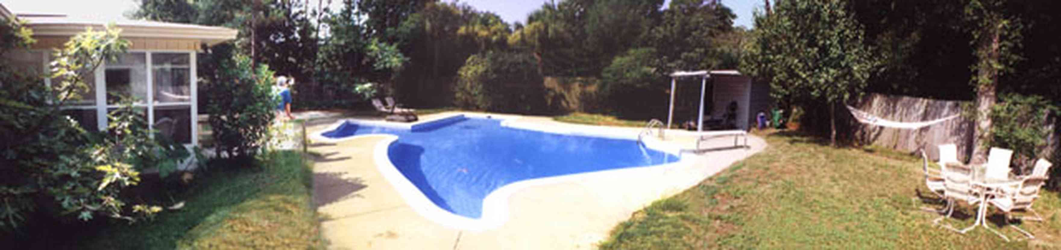 Pensacola:-Cordova-Park-Subdivision_02.jpg:  swimming pool, backyard, subdivision, ranch style house