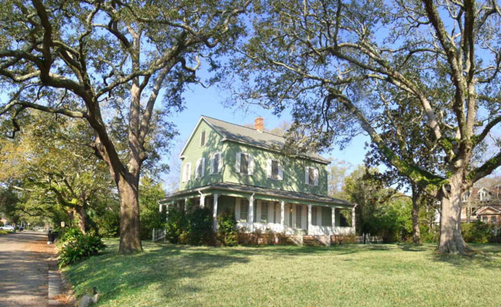 Pensacola:-East-Hill:-10th-Avenue-House_03.jpg:  oak trees, two-story home, porches, gallery , 