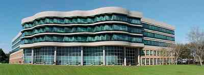 Pensacola:-Gateway-District:-Gulf-Power-Headquarters_01.jpg:  corporate headquarters, corporate building, bayfront parkway, green glass windows