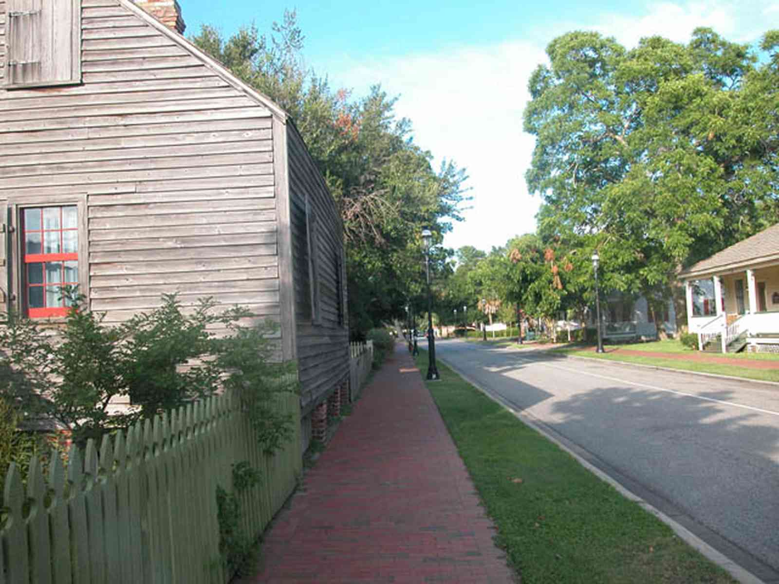 Pensacola:-Historic-Pensacola-Village:-Julee-Cottage_00c.jpg:  brick sidewalk, wood shingle roof, shutters, picket fence, freewoman of color, musuem