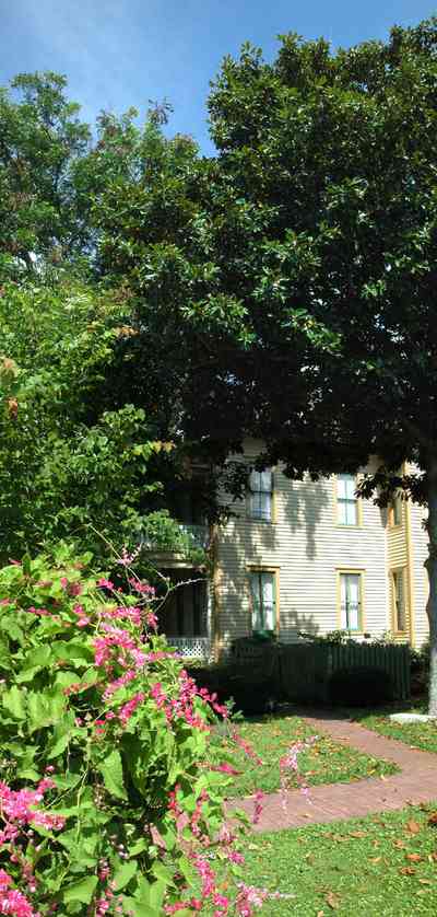 Pensacola:-Historic-Pensacola-Village:-Lear-Rocheblave-House_07bb.jpg:  flowering vines, picket fence, victorian home, historic village