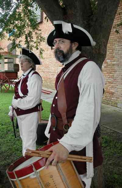 Pensacola:-Historic-Pensacola-Village:-Museum-Of-Commerce_04a.jpg:  drum and phyfe corps, wagon, museum, musicians
