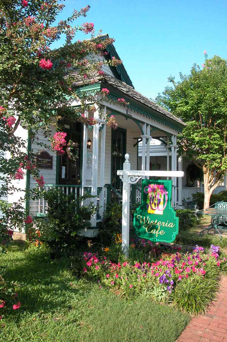 Pensacola:-Historic-Pensacola-Village:-The-Moreno-Cottage_00.jpg:  victorian cottage, crepe myrtle tree, petunias, brick sidewalk