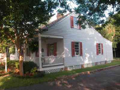 Pensacola:-Historic-Pensacola-Village:-Walton-Cottage_04.jpg:  creole cottage, shutters, victorian front porch, cedar shake roof, pecan trees