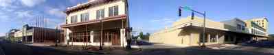 Pensacola:-Palafox-Historic-District:-Post-Office_02.jpg:  downtown streetscape, brick sidewalks, wrought-iron balcony